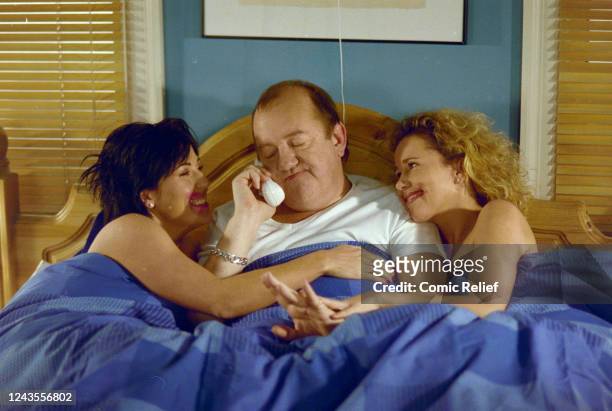Jessie Wallace, Mel Smith and Lucy Benjamin during a special episode of Eastenders broadcast on March 16, 2001 as part of Red Nose 2001 campaign.