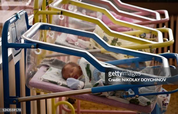 This picture taken on September 13 shows newborn babies in the maternity ward in the Gabrovo hospital. - Empty corridors and only eight babies in...