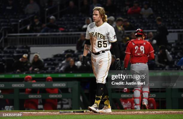 Jack Suwinski of the Pittsburgh Pirates drops his batting helmet after striking out swinging in the third inning during the game against the...