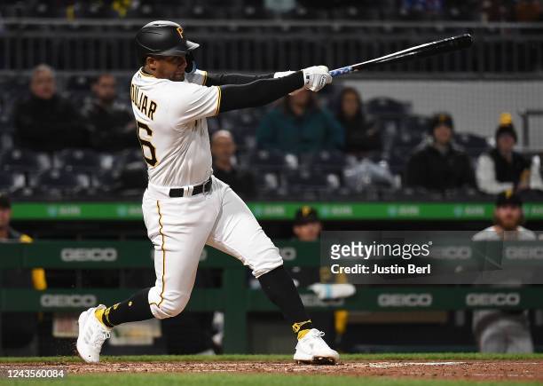 Miguel Andújar of the Pittsburgh Pirates hits a three-run RBI double in the seventh inning during the game against the Cincinnati Reds at PNC Park on...
