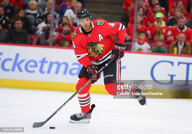 Chicago Blackhawks defenseman Seth Jones skates with the puck in action during a game between the St.Louis Blues and the Chicago Blackhawks on...