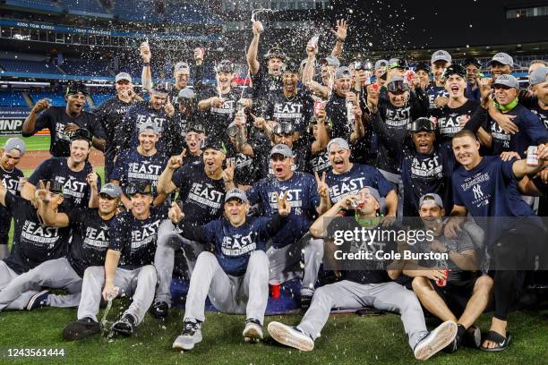 The New York Yankees take a team photo on the mound after their MLB game against the Toronto Blue Jays, as they clinch the AL East, at Rogers Centre...