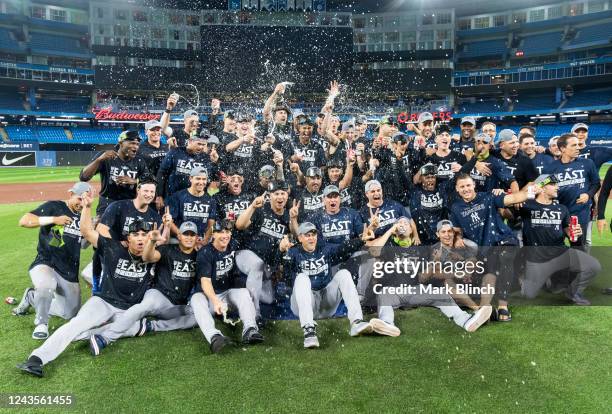 The New York Yankees pose for a team photo on the field after they defeated the Toronto Blue Jays to clinch first place in the AL East in their MLB...