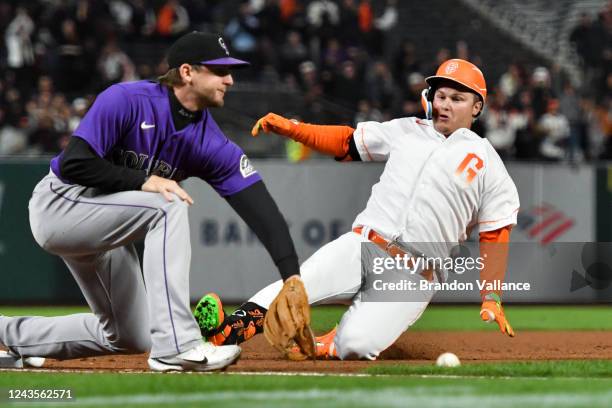 Joc Pederson of the San Francisco Giants slides into third base in the eighth inning against the Colorado Rockies at Oracle Park on September 27,...