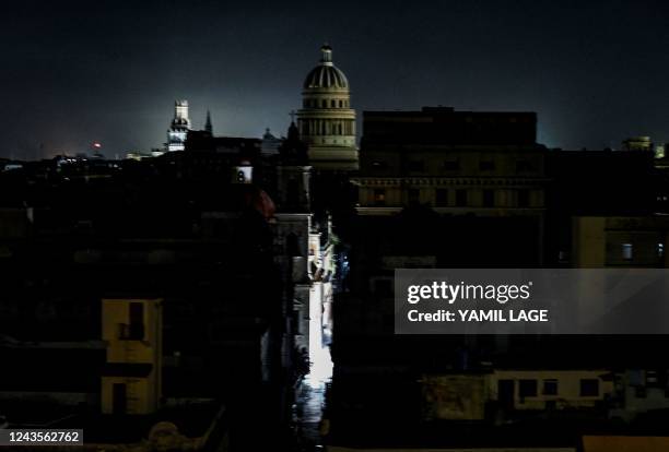 The El Capitolio Nacional building is seen during a blackout in Havana, on September 27, 2022. - Cuba was left in the dark on the night of September...