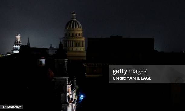 The El Capitolio Nacional building is seen during a blackout in Havana, on September 27, 2022. - Cuba was left in the dark on the night of September...
