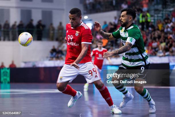 Joao Matos of Sporting CP and Jacare of SL Benfica battle for the ball during the Portugal Futsal Supercup match between Sporting CP and SL Benfica...