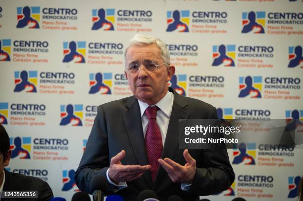 Colombia's former president Alvaro Uribe Velez speaks during a press conference after meeting with president Gustavo Petro on September 27 in Bogota,...