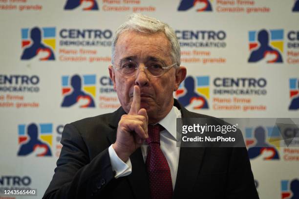Colombia's former president Alvaro Uribe Velez speaks during a press conference after meeting with president Gustavo Petro on September 27 in Bogota,...