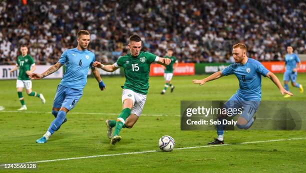 Tel Aviv , Israel - 27 September 2022; Andy Lyons of Republic of Ireland in action against Eden Karzev, left, and Ido Shahar of Israel during the...