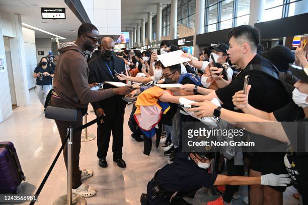 Draymond Green of the Golden State Warriors signs autographs for fans as he arrives in Japan for the 2022 NBA Japan Games on September 28, 2022 in...