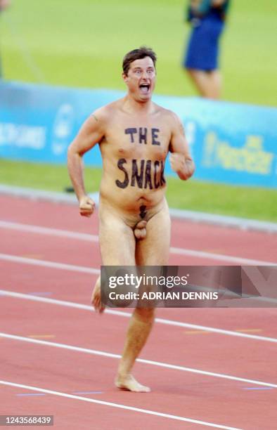 Streaker runs on the track during the 2002 Manchester Commonwealth Games 27 July 2002. AFP PHOTO ADRIAN DENNIS