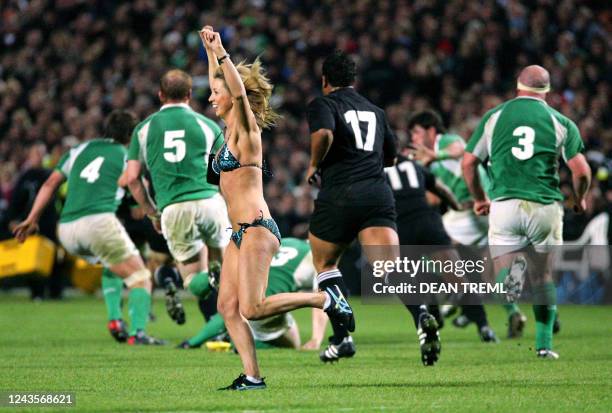 Streaker runs through the field during the first rugby union test match between the New Zealand All Blacks and Ireland at Rugby Park in Hamilton, 10...