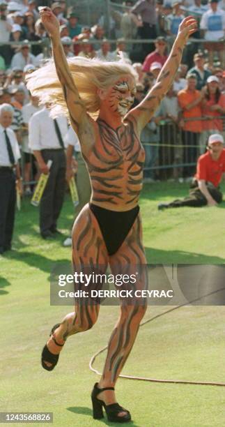 Streaker painted as a tiger runs across the 18th green after Justin Leonard of the US won the 126th British Open Golf Championship, 20 July, at Royal...