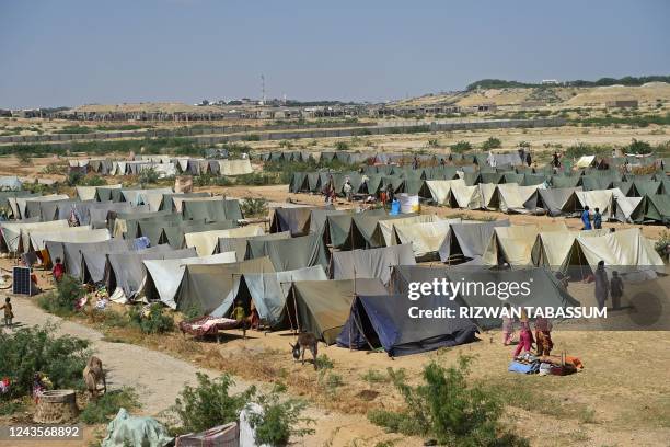 Internally displaced flood-affected people take refuge in a camp at Kotri in Jamshoro district of Sindh province on September 28, 2022.