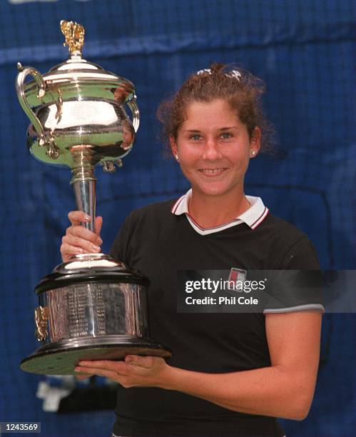 Monica Seles of the USA celebrates with the Australian Open trophy after defeating Anke Huber of Germany to win the final of the Ford Australian Open...