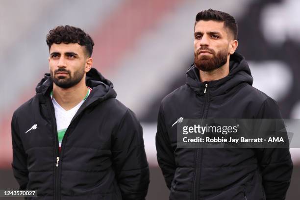 Players of Iran wear jackets to cover up their country's symbols in protest against the brutal repression of women in the Middle East country during...