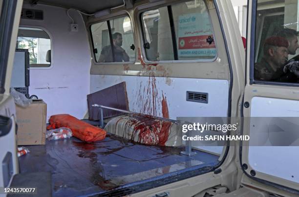 Blood stained ambulance is pictured outside a hospital following strikes by Iran on the village of Altun Kupri, south of the capital Arbil, in Iraq's...