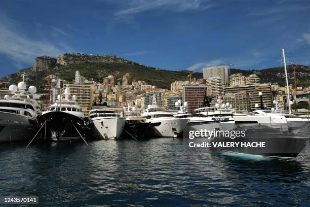 Speed boat motors in front of moored yachts at the Hercules Port in Monaco during the 31st edition of the International Monaco Yacht Show on...