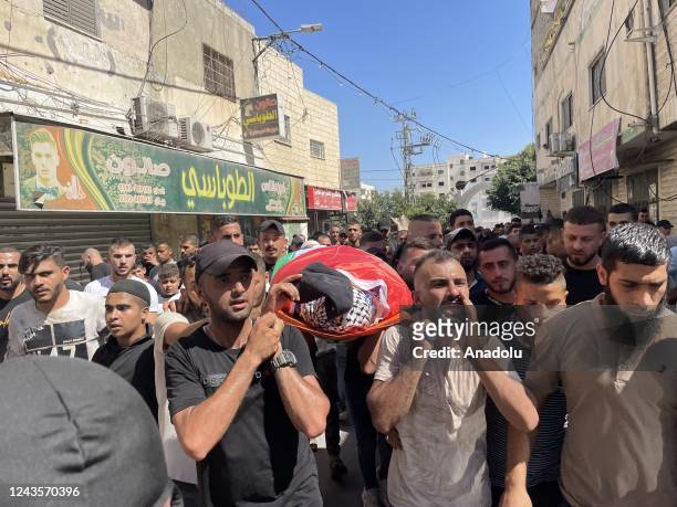 Palestinians gather to attend the funeral ceremony of Abulfathi Khazima, killed by Israeli forces into Jenin refugee camp, at the Jenin refugee camp...