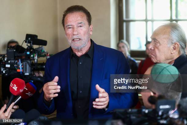 Arnold Schwarzenegger is seen speaking inside a former synagogue that now is home to the Auschwitz Jewish Center Foundation, after visiting former...