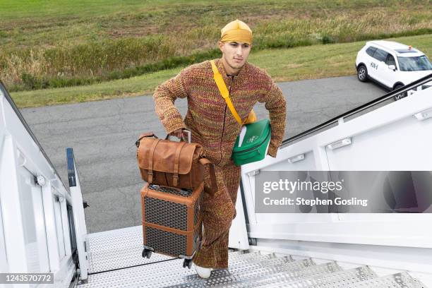 Kyle Kuzma of the Washington Wizards boards the plane to Japan as part of the 2022 NBA Japan Games on September 27, 2022 in Washington, DC. NOTE TO...