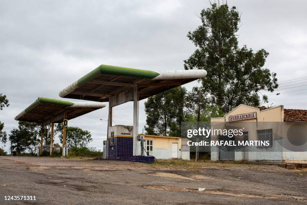 This photograph taken on August 31, 2022 near the city of Itaberaba, in Bahia state, Brazil, shows an abandoned Apetrol petrol station.