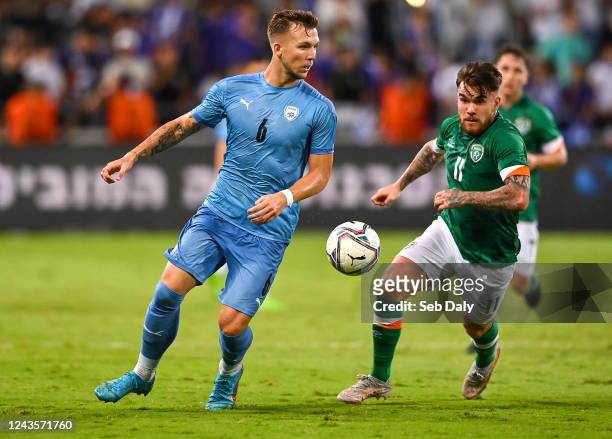 Tel Aviv , Israel - 27 September 2022; Eden Karzev of Israel in action against Aaron Connolly of Republic of Ireland during the UEFA European U21...