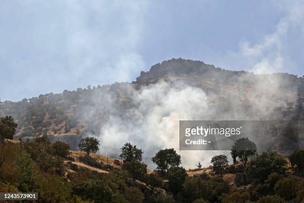 Smoke billows following an Iranian cross-border attack in the area of Zargwez, where several exiled left-wing Iranian Kurdish parties maintain...
