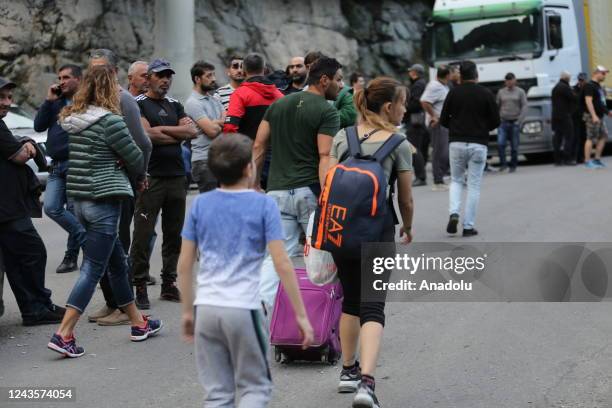 Russians are seen attempting to leave their country to avoid a military call-up for the Russia-Ukraine war as queues have formed at the Kazbegi...