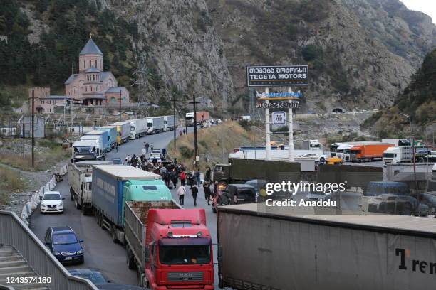 Russians are seen attempting to leave their country to avoid a military call-up for the Russia-Ukraine war as queues have formed at the Kazbegi...