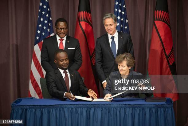 Malawian President Lazarus Chakwera and US Secretary of State Antony Blinken watch as Millennium Challenge Corporation CEO, Alice Albright and...