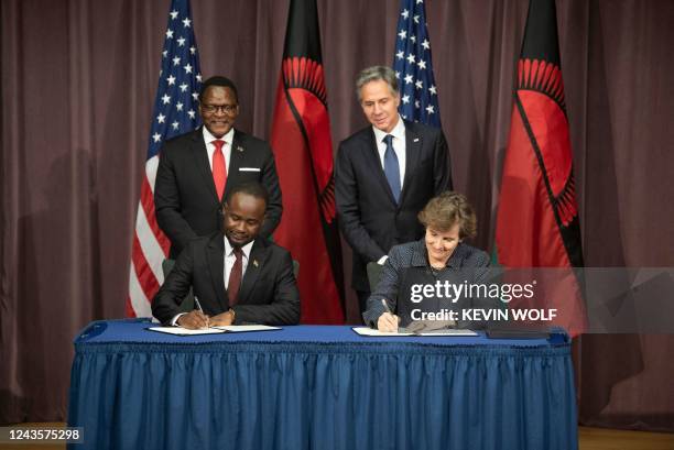 Malawian President Lazarus Chakwera and US Secretary of State Antony Blinken watch as Millennium Challenge Corporation CEO, Alice Albright and...