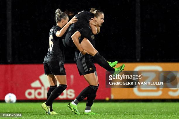 Arsenal's Dutch forward Vivianne Miedema celebrates scoring the 0-1 goal during the UEFA Champions League women's second round football match between...