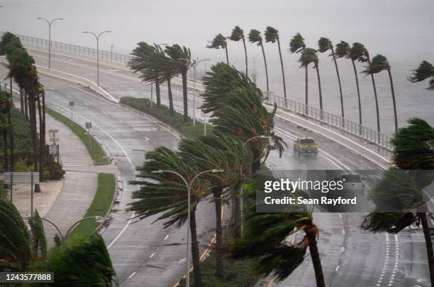 Motorists travel across the John Ringling Causeway as Hurricane Ian churns to the south on September 28, 2022 in Sarasota, Florida. The storm made a...