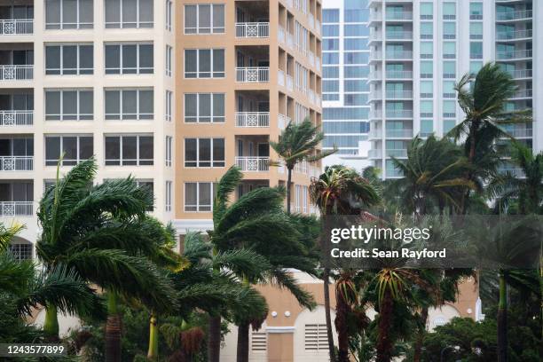 Wind gusts blow between condominiums as Hurricane Ian churns to the south on September 28, 2022 in Sarasota, Florida. The storm made a U.S. Landfall...