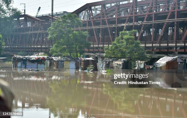 View of partially submerged houses along the bank of Yamuna river amid scare of water level rise beyond the danger mark, near Old Iron Bridge, on...