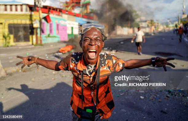 Man demands the resignation of Prime Minister Ariel Henry after he put up road barricades during a general strike in Port-au-Prince, Haiti, September...