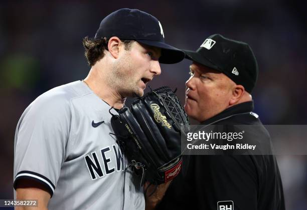 Gerrit Cole of the New York Yankees speaks to Umpire Brian ONora in the third inning against the Toronto Blue Jays at Rogers Centre on September 28,...