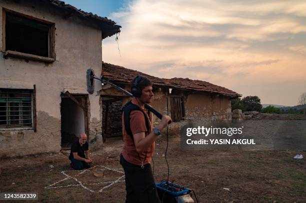 Members of the crew and an actor work on ''Forbidden Wedding'' during filming in Buyukorhan, in the outskirts of Bursa on September 1, 2022. - In an...