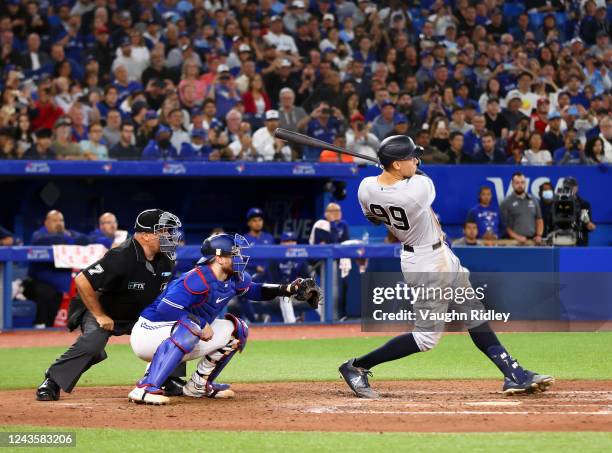 Aaron Judge of the New York Yankees hits his 61st home run of the season in the seventh inning against the Toronto Blue Jays at Rogers Centre on...