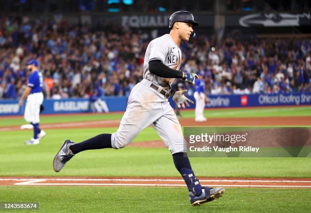 Aaron Judge of the New York Yankees celebrates after hitting his 61st home run of the season in the seventh inning against the Toronto Blue Jays at...
