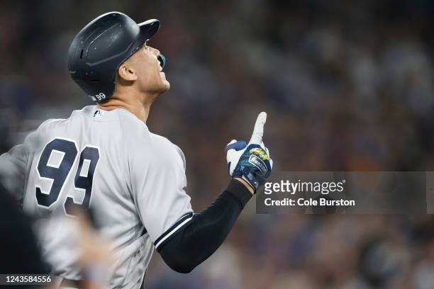Aaron Judge of the New York Yankees runs the bases as he hits his 61st home run of the season in the seventh inning against the Toronto Blue Jays at...
