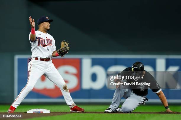 Jose Abreu of the Chicago White Sox is out at second base as Luis Arraez of the Minnesota Twins reacts to his throw on a double play in the seventh...