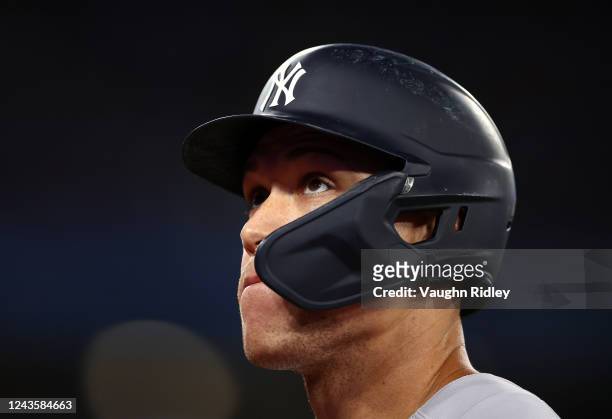 Aaron Judge of the New York Yankees leaves the field after grounding out in the eighth inning against the Toronto Blue Jays at Rogers Centre on...