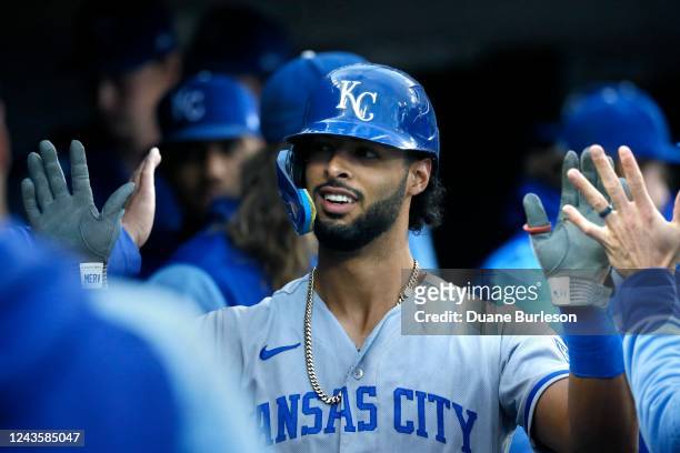 Melendez of the Kansas City Royals is congratulated after hitting a solo home run against the Detroit Tigers during the first inning at Comerica Park...