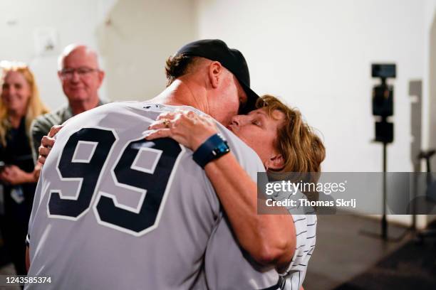 Aaron Judge of the New York Yankees hugs his mother, Patty, after defeating the Toronto Blue Jays and tying Roger Maris AL home run record at Rogers...