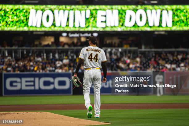 Joe Musgrove of the San Diego Padres walks off the mound after a strikeout in the first inning against the Los Angeles Dodgers at PETCO Park on...