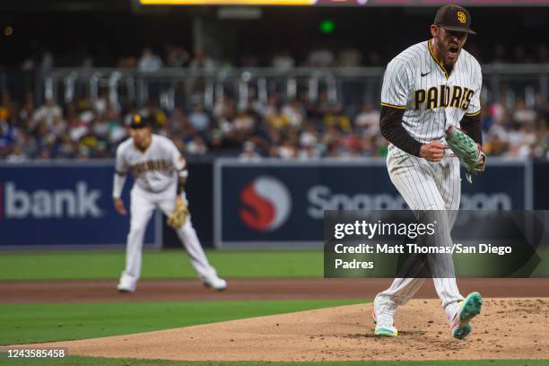 Joe Musgrove of the San Diego Padres celebrates after a strikeout at the end of the first inning against the Los Angeles Dodgers at PETCO Park on...