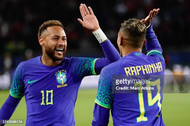 Neymar of Brazil celebrates with Raphinha of Brazil after he scores a penalty to make it 4-1 during the International Friendly between Brazil and...